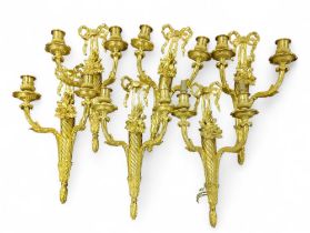 A set of six gilt metal Louis XVI style twin branc