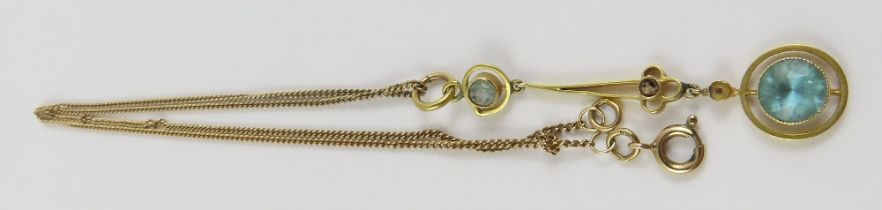 An early 20th century pendant, set with a blue zir