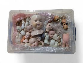 A quantity of bisque dolls heads, various sizes, a