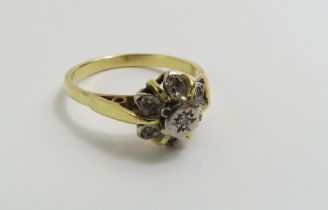 A diamond cluster ring, in the form of a flower, f