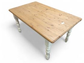 A pine scrub top table on turned supports 76cms hi