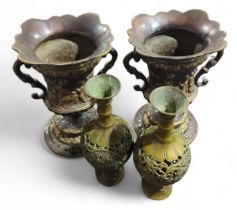 A pair of heavy cast metal two handled vases, 28cm