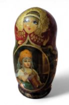 A large Russian Matryoshka doll, of nine decorativ