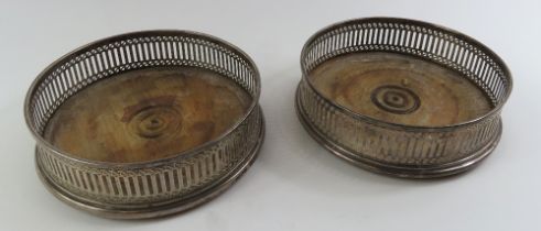 A pair of silver wine bottle coasters, London, 197