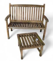 A wooden garden bench, of slat formation, together