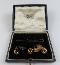 Three 9ct gold dress studs in case, a 9ct gold tie