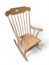A light beech stick back rocking chair