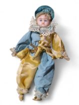A wax over composition doll with inset blue eyes,