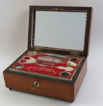 A late 19th/early 20th Century sewing box the lid
