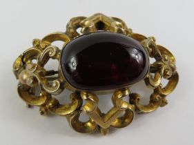 A Victorian gilt metal mourning brooch, set with a