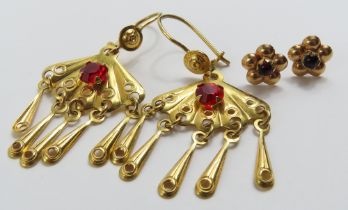 A pair of fan shaped drop earrings, marked '750',