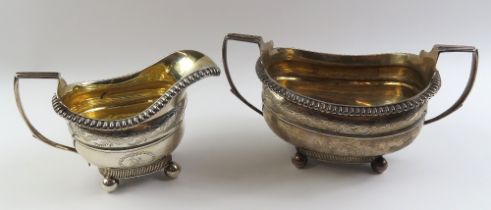 A Georgian silver two handled sucrier and cream ju