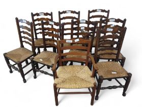 A set of eight ladder back rush seated dining chai