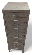 A tall metal cabinet of twelve drawers 99cms high 34.5