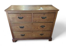 An Edwardian pine chest of two short and three lon