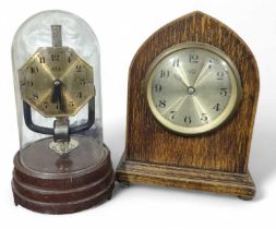 A Bulle electric anniversary style clock under a g