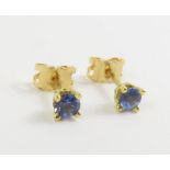 A pair of 18ct gold tanzanite single stone stud ear