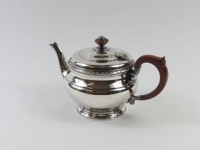 A silver teapot, made by Ollivant & Botsford in Bi