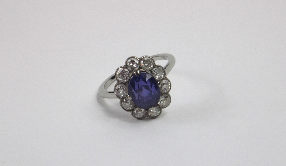 An early 20th century violet colour change sapphire and diamond cl - Image 14 of 17