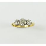 An early 20th century old cut diamond three stone