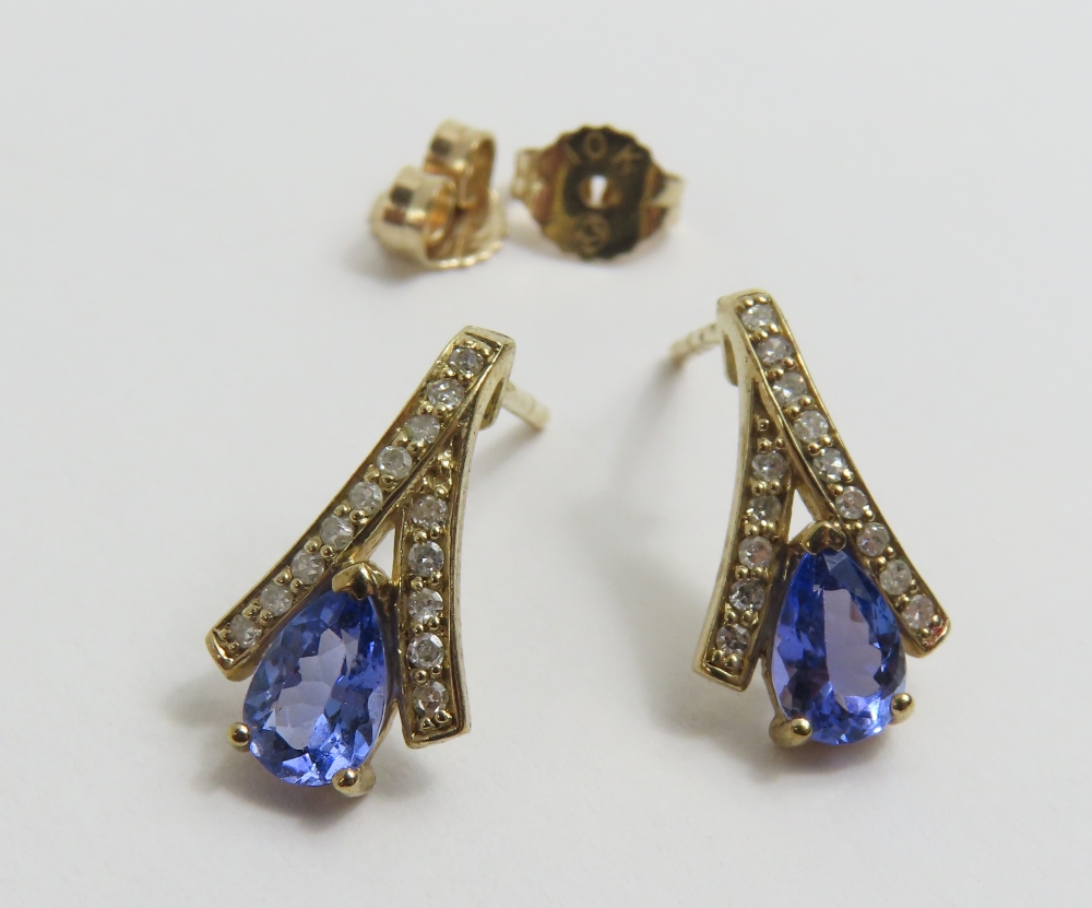 A pair of 9ct gold tanzanite and diamond stud earr