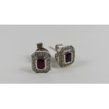 A pair of 18ct white gold ruby and diamond cluster