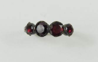 A Georgian four stone flat cut garnet ring, with a