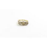 A three stone old cut diamond ring, marked '18ct',