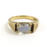 A 9ct gold moonstone dress ring, the oval cabochon