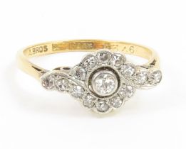 An early 20th century old cut diamond daisy style