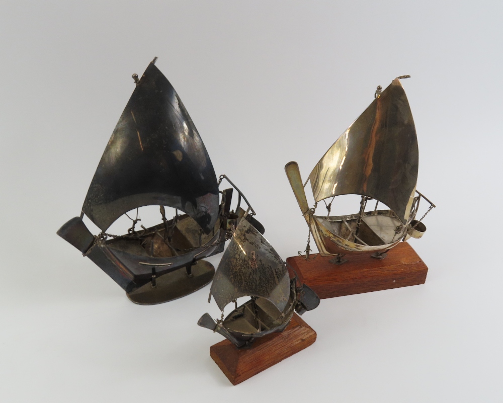 A silver model of a junk, 20cm high, 10oz and two