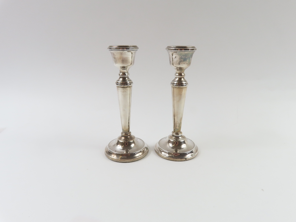 Two silver candlestick holders, made by A. T. Cann