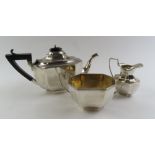 A three piece silver tea set by Charles S Green &