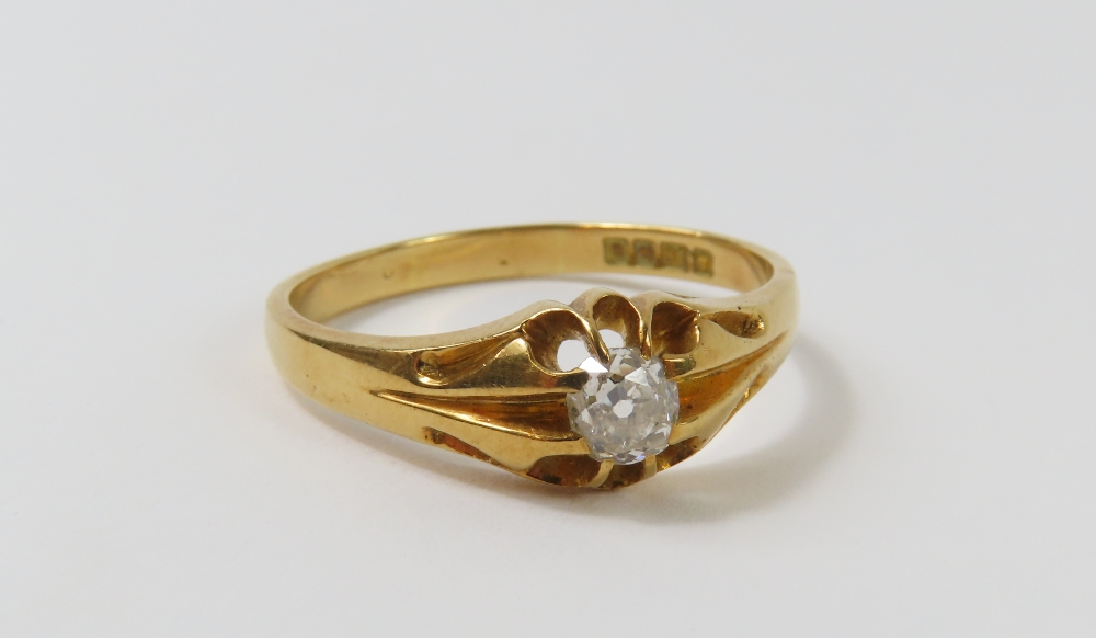 An early 20th century 18ct gold gypsy ring, set wi