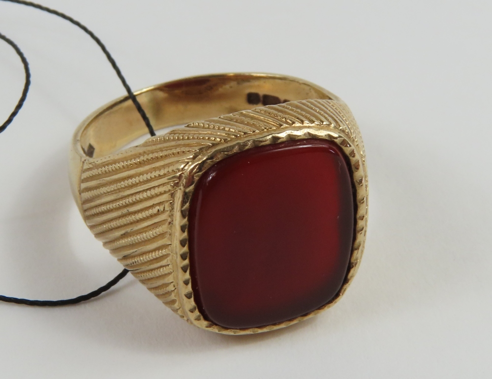 A 9ct gold carnelian set signet ring, the rectangu