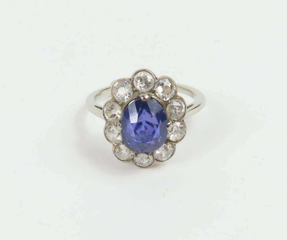 An early 20th century violet colour change sapphire and diamond cl