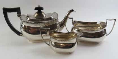 A silver three piece tea set, by Barker Brothers,