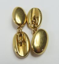 A pair of heavy rounded oval panel cufflinks, with