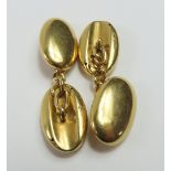 A pair of heavy rounded oval panel cufflinks, with