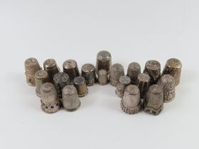 A collection of twenty silver thimbles of various