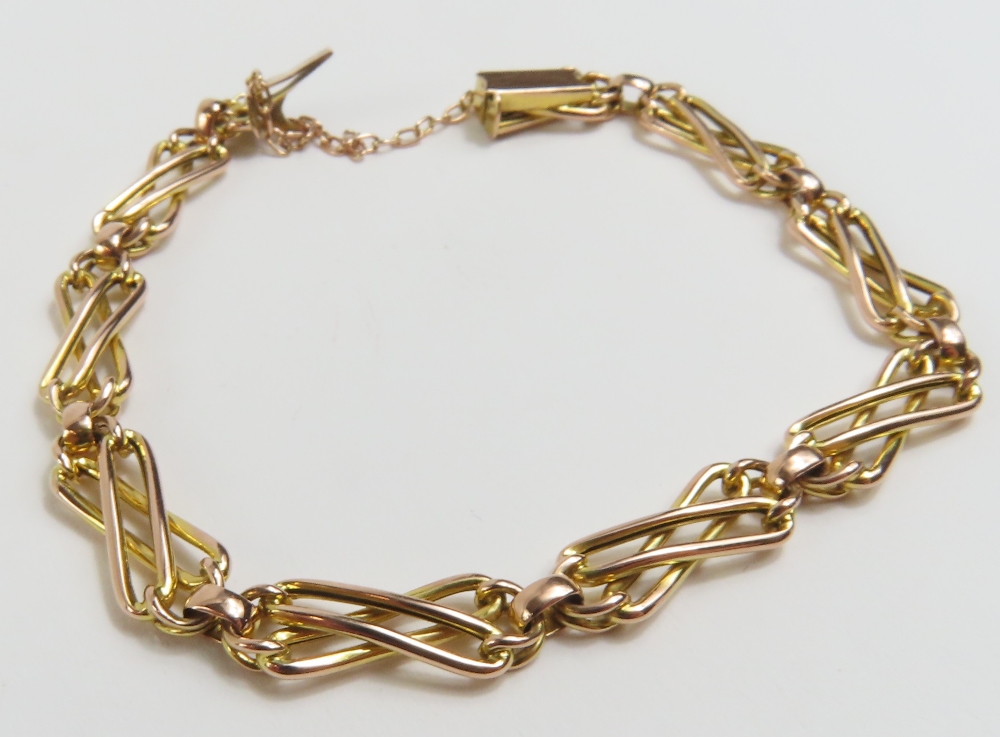 A fancy link bracelet, the open weave links with oval