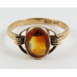 An early 20th century citrine ring, with deco