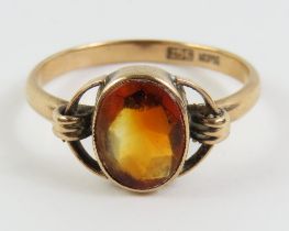 An early 20th century citrine ring, with deco