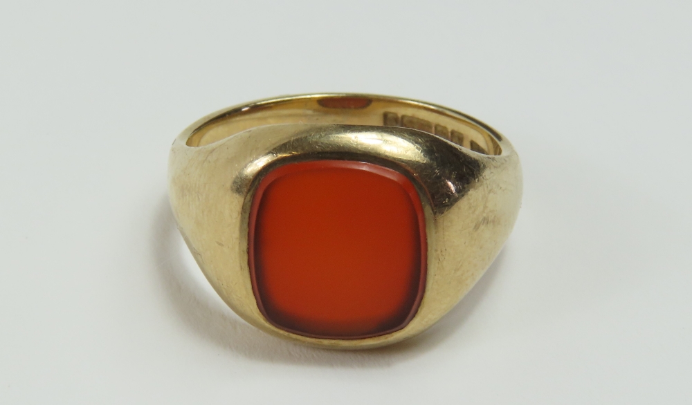 A 9ct gold signet ring, set with a square cut carn