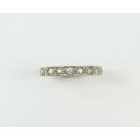 An old cut diamond full eternity ring, with bead d