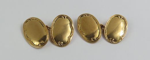 A pair of 15ct gold oval panel cufflinks, with dec