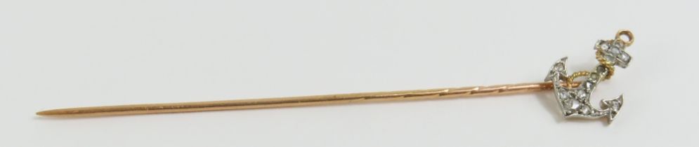 A stick pin set with an anchor to the top, the anc