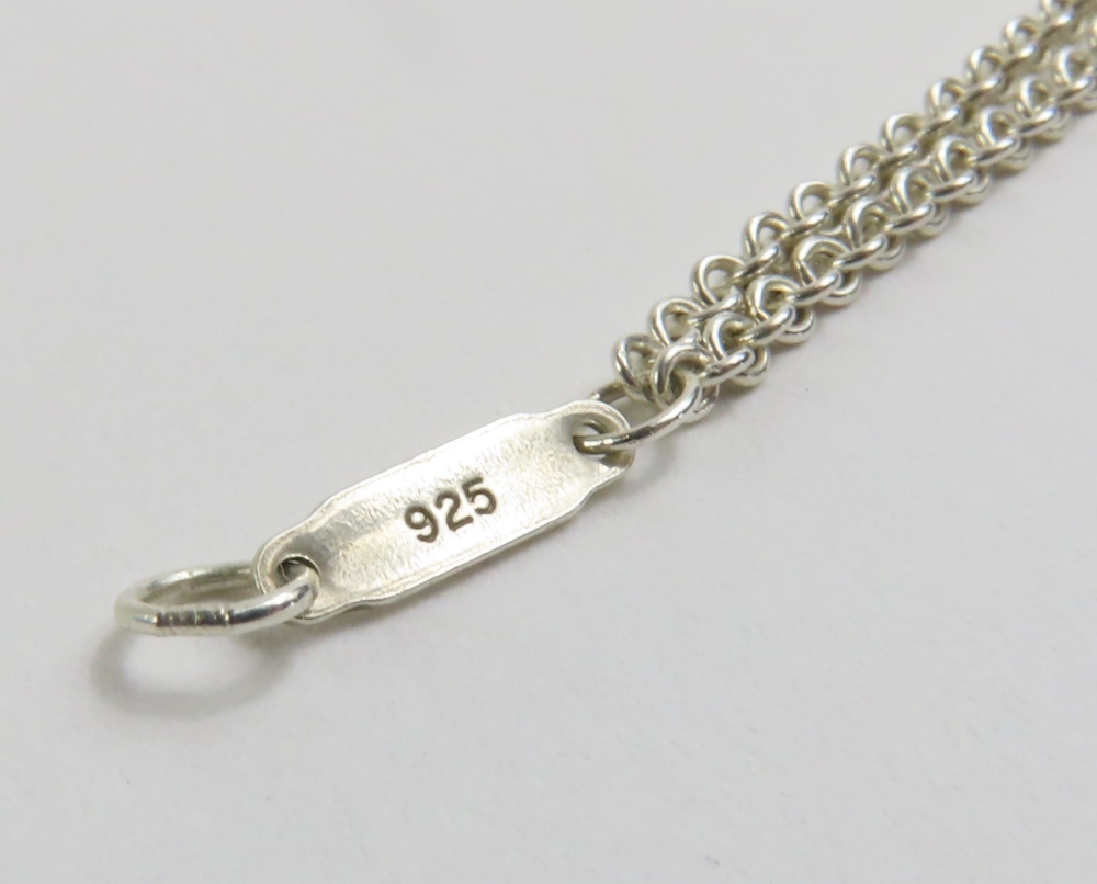 Tiffany & Co - a silver Infinity pendant necklace, - Image 6 of 12