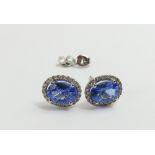 A pair of 18ct white gold tanzanite and diamond cl