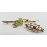 A small early 20th century brooch set with a purpl